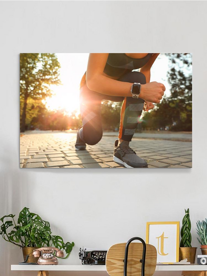 Runner Woman Getting Ready Wrapped Canvas -Image by Shutterstock