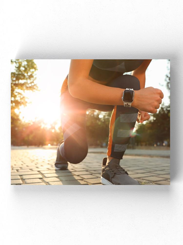 Runner Woman Getting Ready Wrapped Canvas -Image by Shutterstock