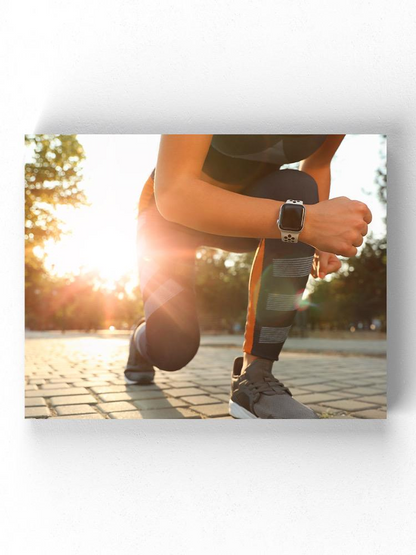 Runner Woman Getting Ready Wrapped Canvas -Image by Shutterstock