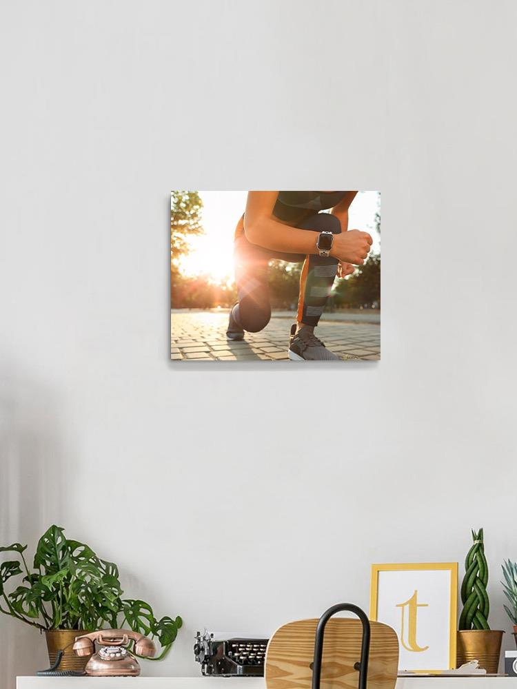 Runner Woman Getting Ready Wrapped Canvas -Image by Shutterstock