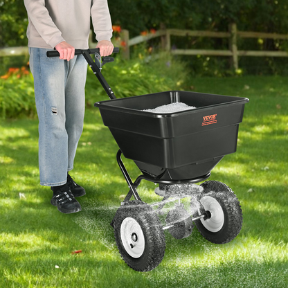 VEVOR Broadcast Spreader, 100 LB Walk-Behind Turf Spreader with 12" Wheels, Steel Push Fertilizer Spreader, Garden Seeder, and Salt Spreader, Designed for Residential, Farm, and Tough Terrain, Black